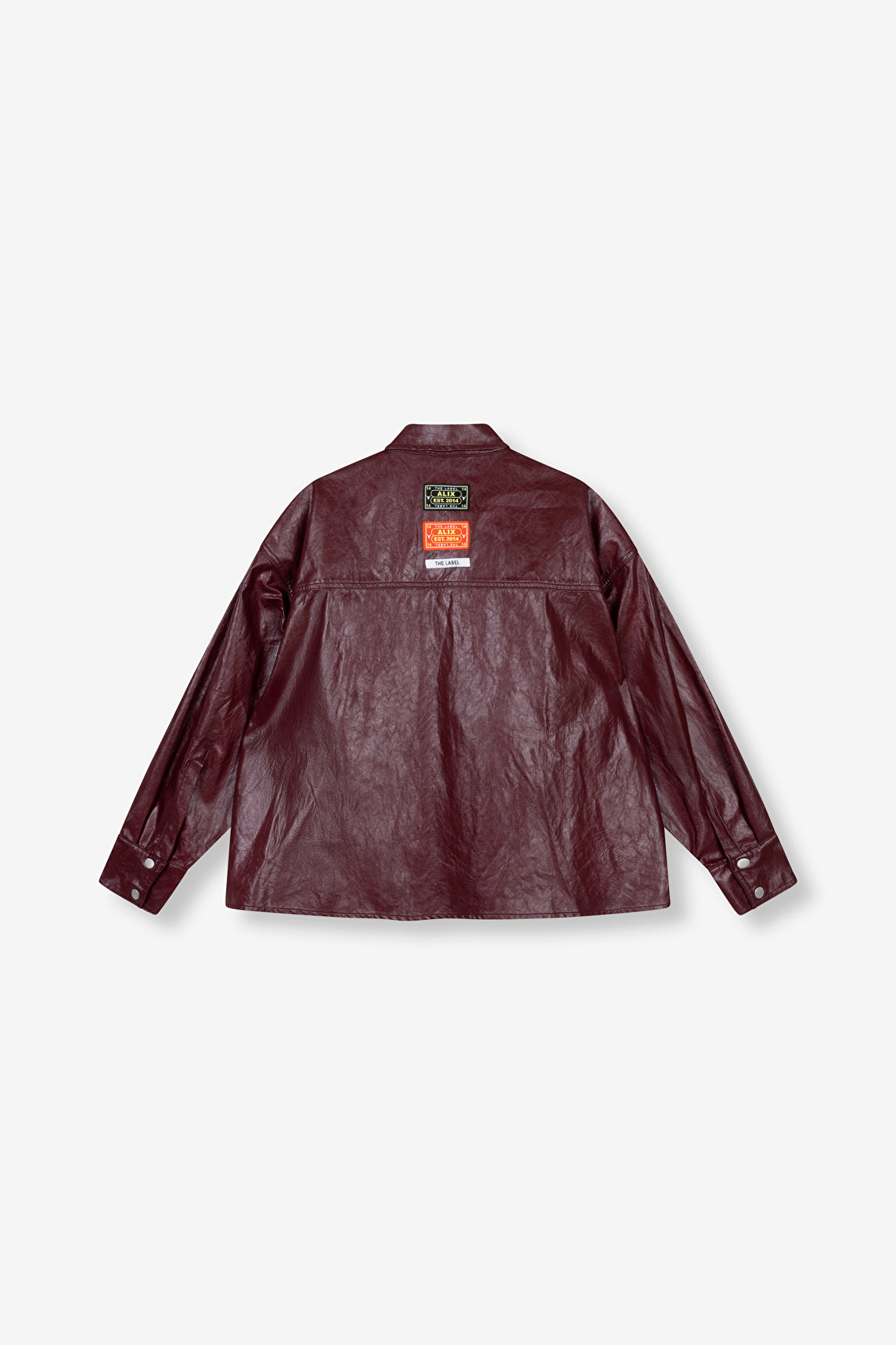 Blouse Faux Leather bordeaux effet craquelé avec étiquelle ALIX THE LABEL au dos.
