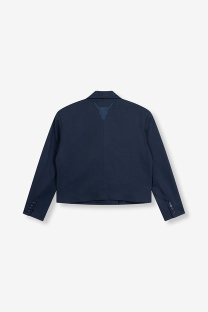 Blazer double boutonnage bleu marine Alix The Label vu de dos avec broderie tête de taureau.