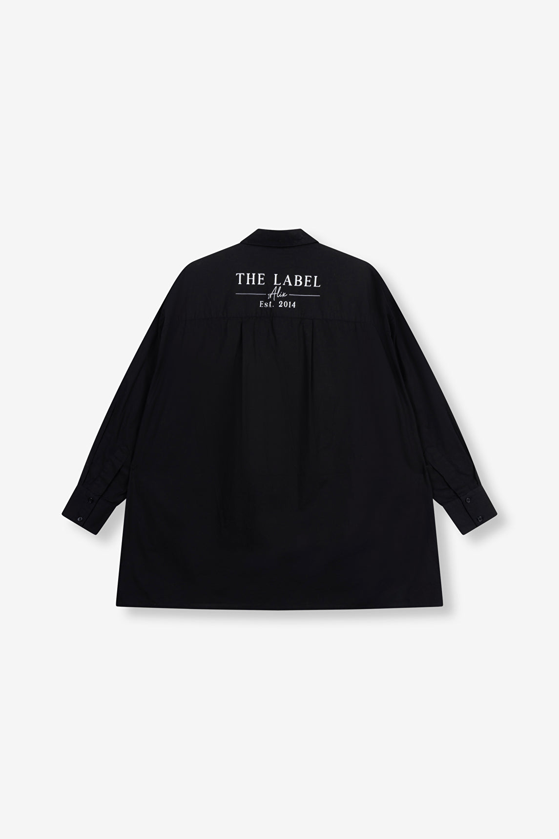 Blouse Oversized Poplin noire Alix The Label avec logo imprimé dans le dos.