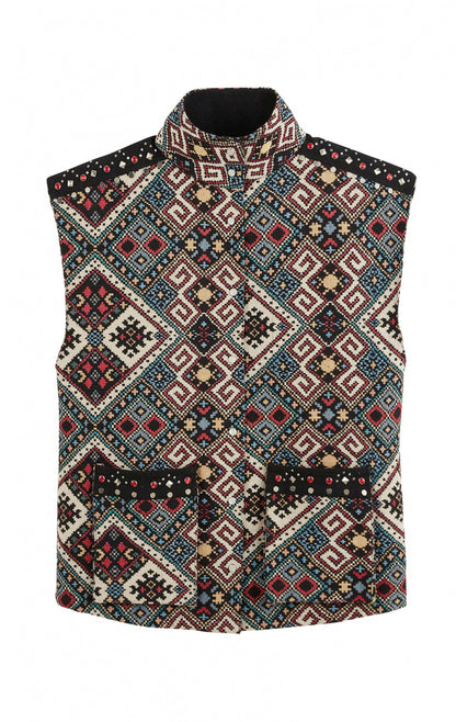 Veste Janna sans manches WILD avec motifs navajos effet kilim, col montant et poches plaquées ornées de studs métalliques et rouges
